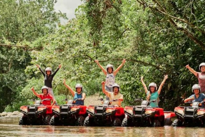 a group of people riding on the back of a boat