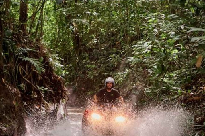 a man riding on top of a river